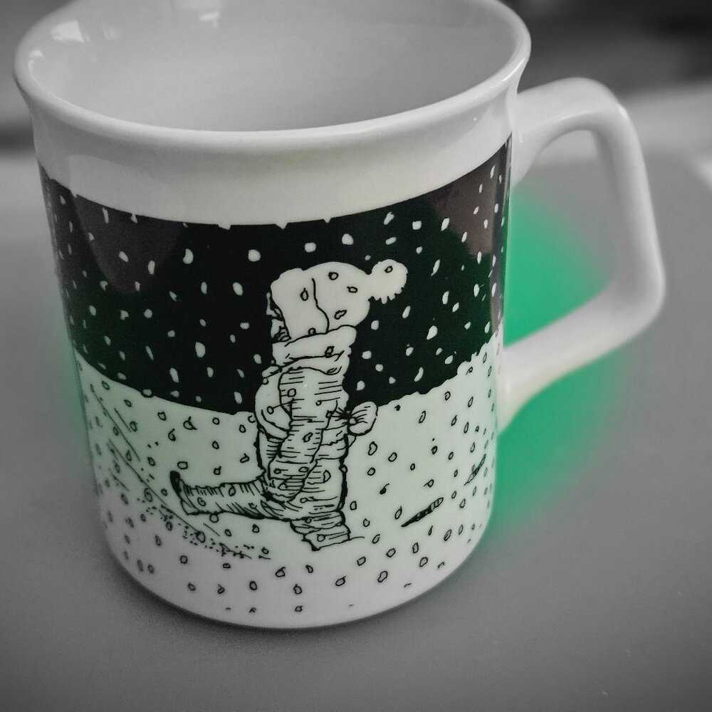 two metropolitan museum cups one floral one kid in the snow 2 cups